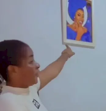 Lady hangs her photo in boyfriend's house to stop him from cheating (Video)