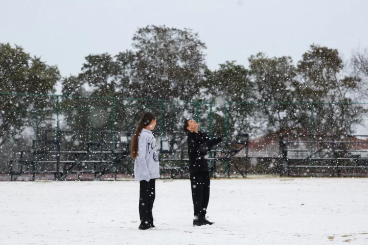 Children play in the snow at Laerskool Orion