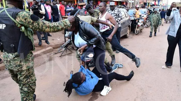 Ugandan security forces arrest protesters marching in Kampala