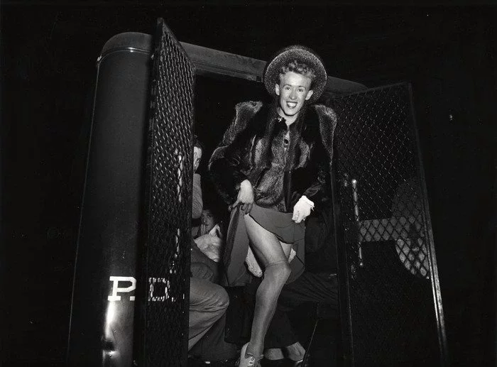 A Man Arrested For Cross-Dressing Emerging From A Police Van, New York, 1939