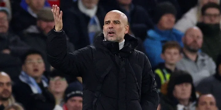 Manchester City boss Pep Guardiola reacts to a decision on the touchline