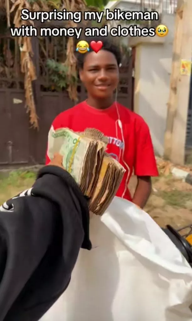 Emotional moment lady surprises her bikeman with cash and clothes