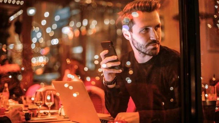 man on phone at table