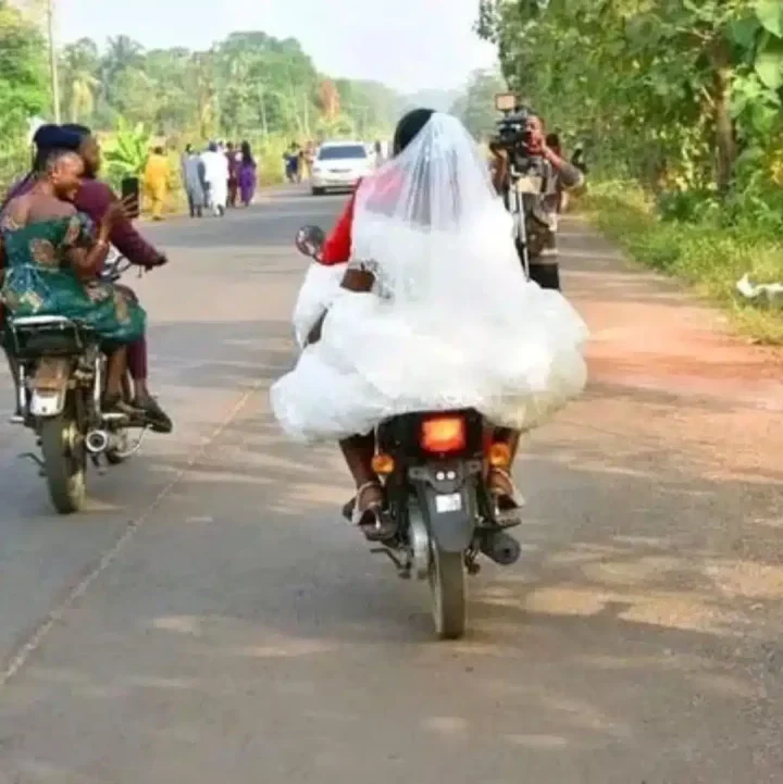 'Life no suppose hard' - Adorable moment bride and groom arrive church on a bike