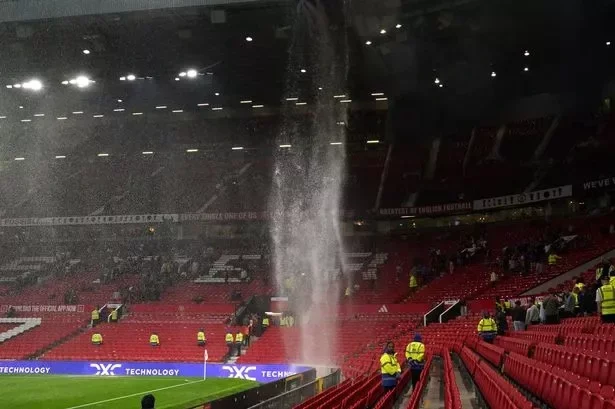 Water bucketed down through the leaky roof at Old Trafford summing up a dismal day for Manchester United fans