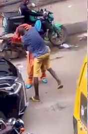Man beats up masquerade for flogging him in Lagos (Video)