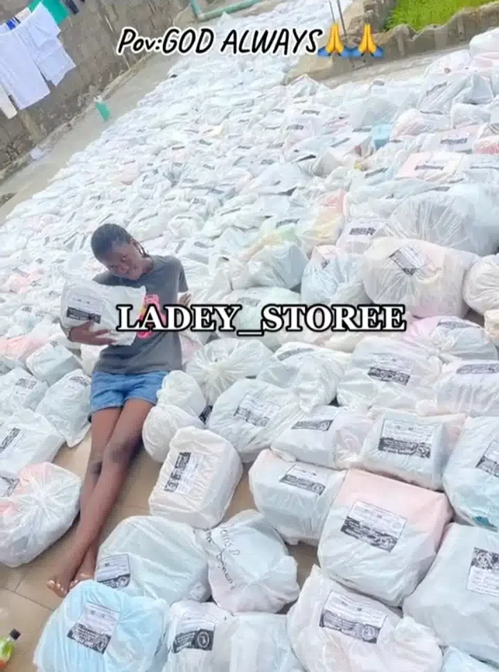 Businesswoman sheds tears of joy as she shows off trailer load of customers' orders (Video)