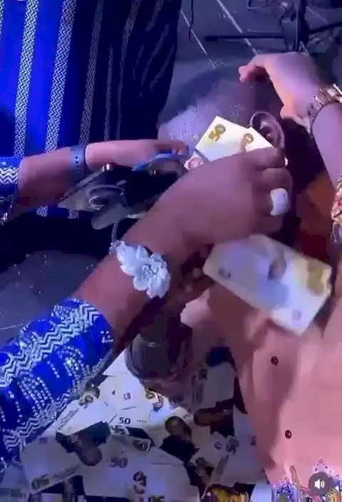 Naira Scarcity: Event planners print 'special money' sprayed at event (Video) Naira Scarcity: Event planners print 'special money' sprayed at event (Video)