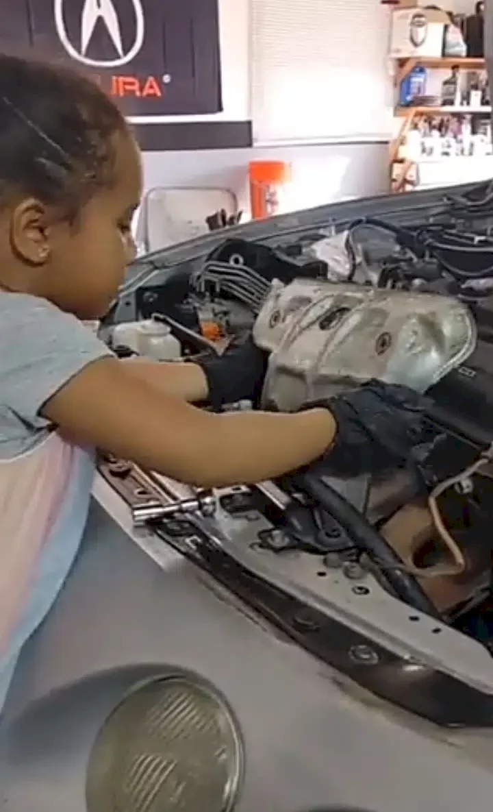 Four-year-old girl mechanic becomes an internet sensation after being filmed expertly repairing a car (Video)