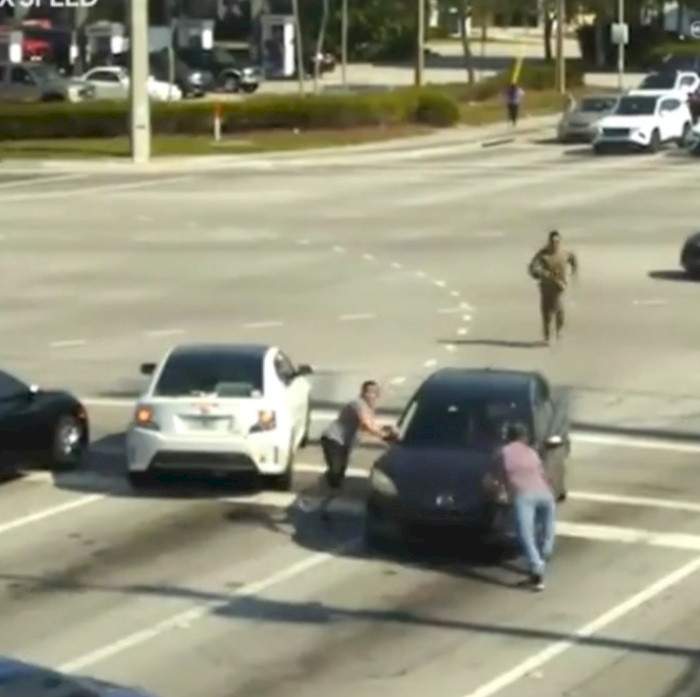 Good Samaritans help to stop a woman's car after she suffered a medical emergency while driving in Florida (video)
