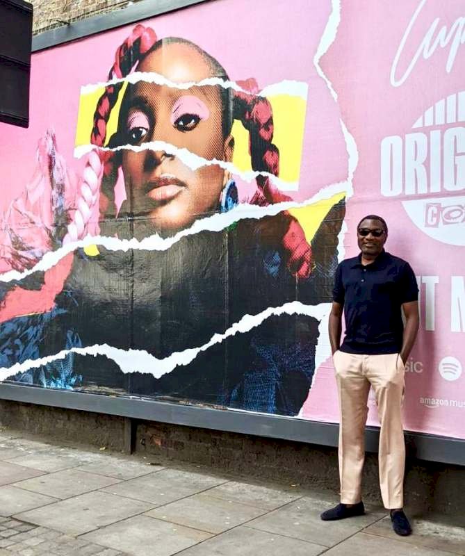 'Nothing better than a proud dad' - Reactions as Femi Otedola pose beside DJ Cuppy's billboard