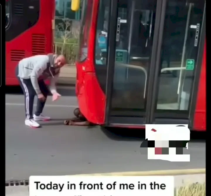 Nigerian man lies under bus in protest after being reportedly denied permanent residency in UK (Video)