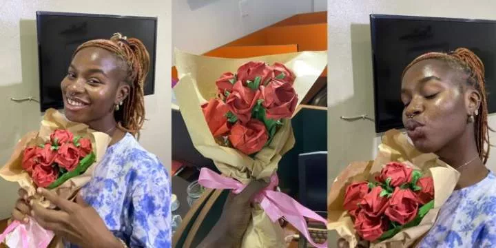 "If he wanted to, he would" - Reactions as Nigerian man makes paper bouquet for his girlfriend because he couldn't afford real roses