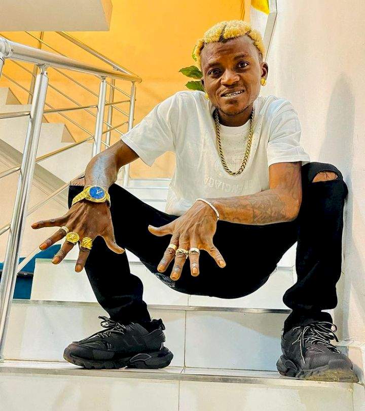 "D guy no wan hear stories" - Reactions as Portable tightly secures dollar bills sprayed on him by Davido (Video)