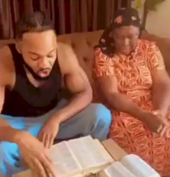 Singer, Flavour warms hearts with video of him reading Bible verse to his mum during devotion (Watch)
