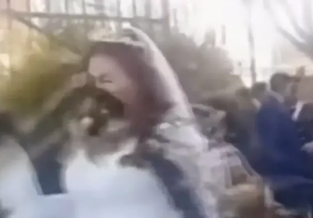 Groom's ex- girlfriend throws poop at him and new bride after storming their wedding (video)