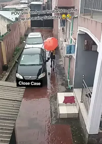 Lady stuns many as she sends out her husband to grind pap in heavy rain