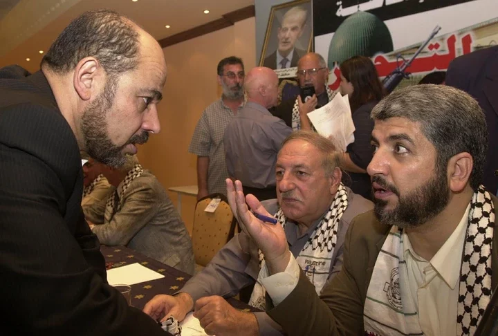 Hamas leaders Moussa Abu Marzouk, left, and Khaled Meshaal, right, moved to Qatar in 2012 when an office was established for the terror group in Doha