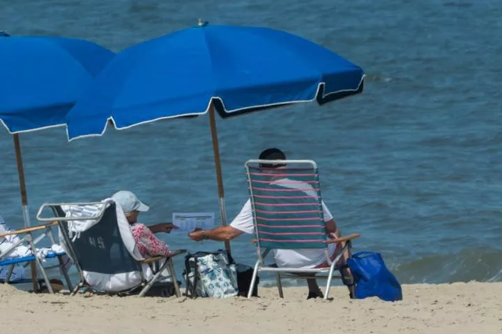 US president Joe Biden chills on beach for second straight week after vowing to 