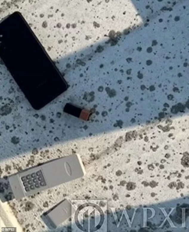 The remote detonator is seen next to Thomas Crooks' cellphone