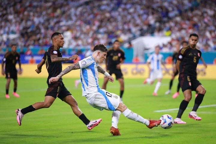 Alejandro Garnacho of Argentina takes a shot during the CONMEBOL Copa America 2024 Group A match between Argentina and Peru at Hard Rock Stadium on...