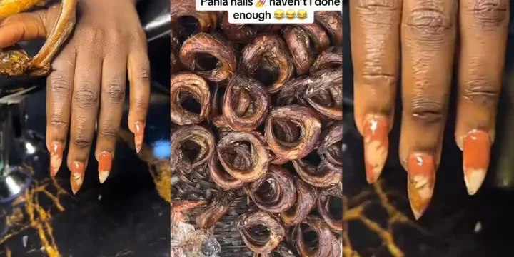 Nigerian lady takes fashion to the next level by applying fish to her nails