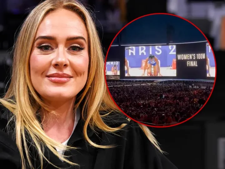 Singer Adele pauses Munich concert performance to watch women's 100m final
