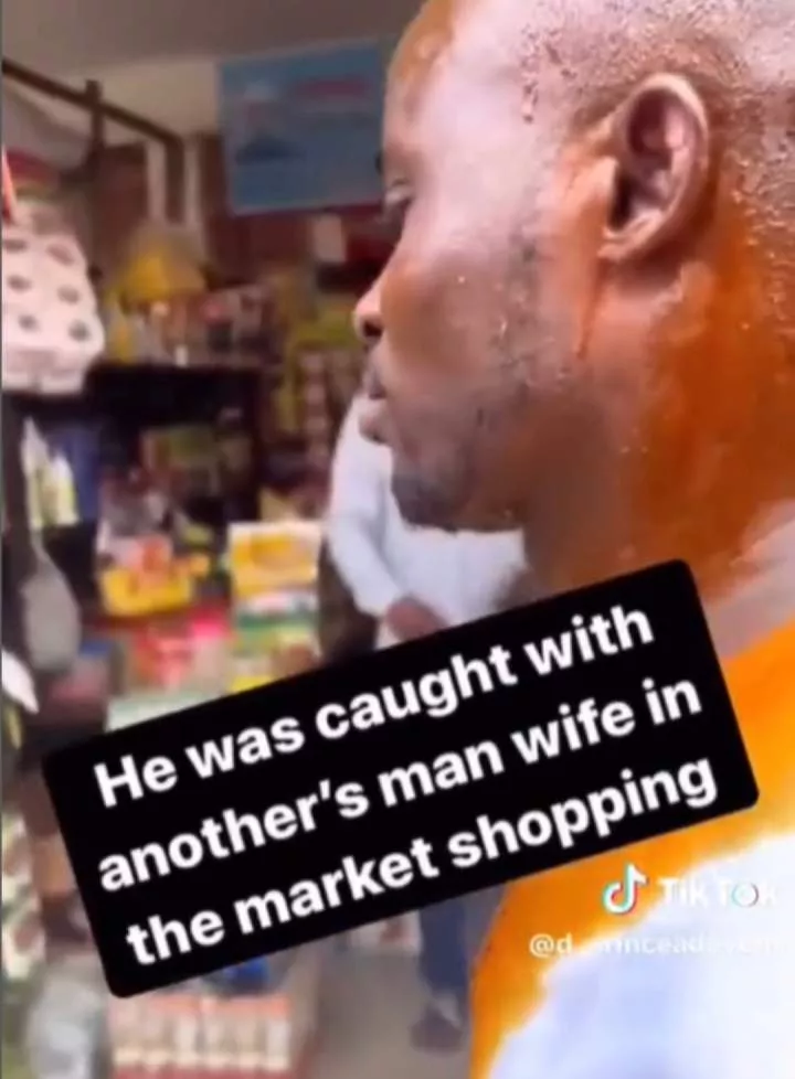 Man disgraced after being spotted shopping in a market with another man?s wife (video)