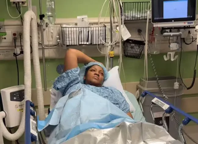 Omotola Jalade in hospital bed, battles life threatening illness (Video)