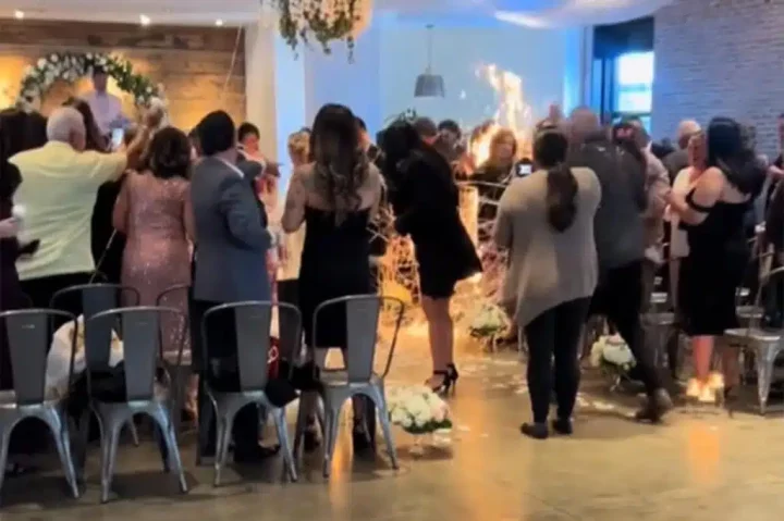 Bride's wedding gown catches fire by fancy candles