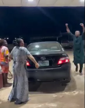 Man hails wife after she filled up his car tank