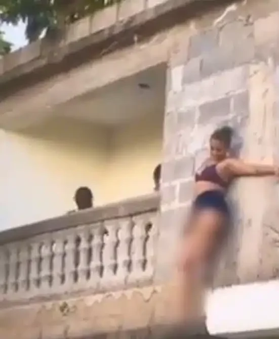 Side chick hides outside balcony to escape sugar daddy's wife (Video)