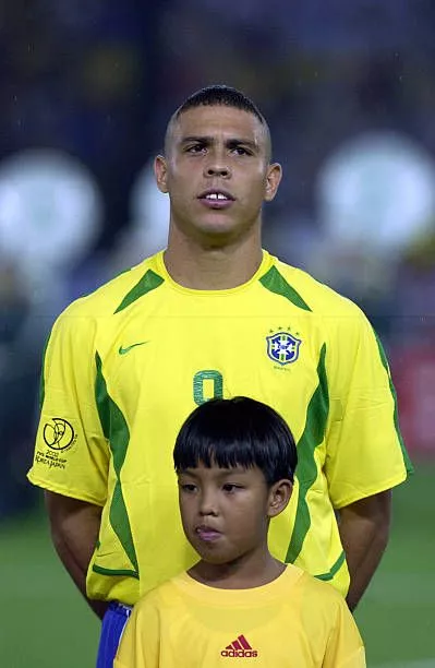 Another photo Ronaldo with a young boy wearing this hairstyle