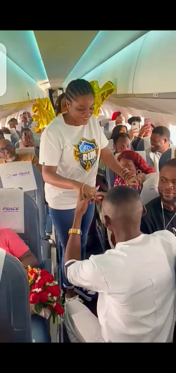 [Photos] Nigerian Man Proposes To Girlfriend Mid-Air On Air Peace Flight