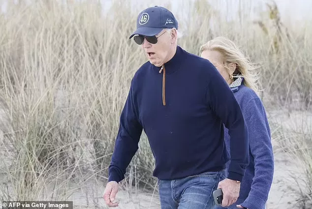 Unsteady Joe Biden stumbles as he battles through sand on beach in Delaware sparking fresh concern