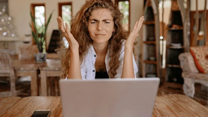 woman frustrated looking at computer scene