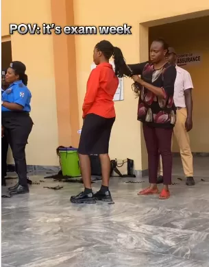 Outrage trails viral video of university staff cutting off female students' braids