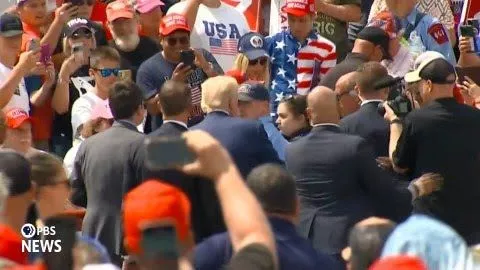 Trump steps outside bulletproof glass to hug woman having medical emergency during his rally (video)