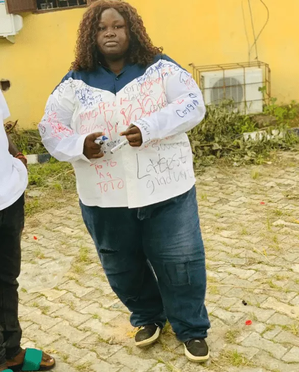 Photos of plus-sized female graduate goes viral as she signs out in grand style