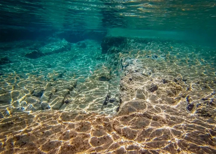 An underwater view of sunken ruins