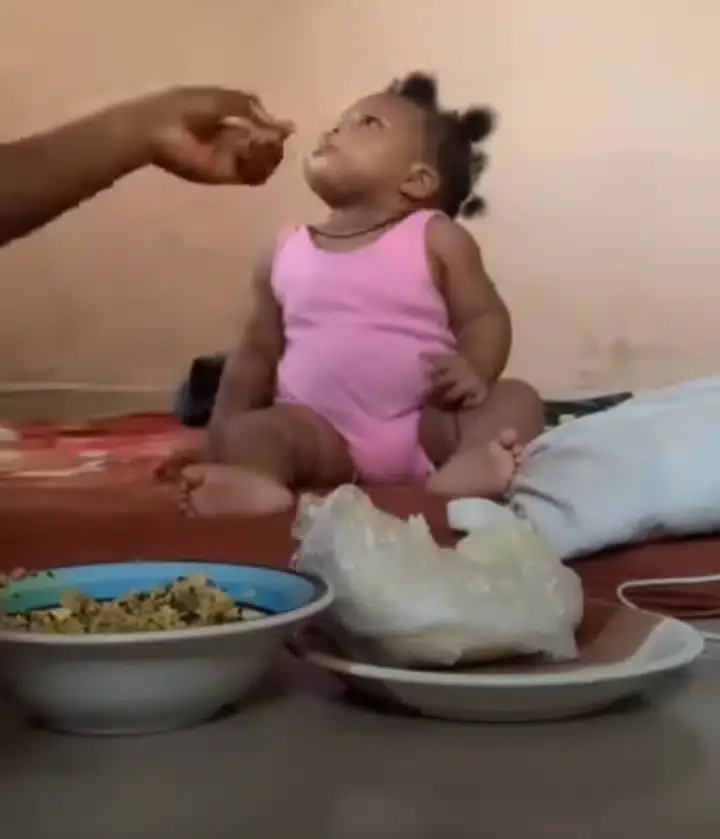 'My baby only eats fufu' - Mother shares video as 6-month-old daughter rejects pap and baby food