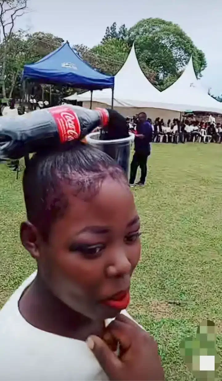 'Creativity that dazzles' - Young lady flaunts Coca-cola-inspired hairstyle (Video)