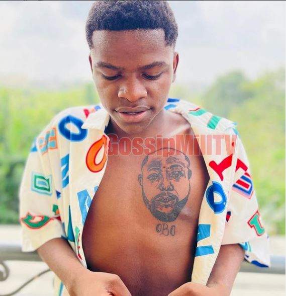 'Nah OBO monkey be this' - Reactions as man inks Davido's face on his chest