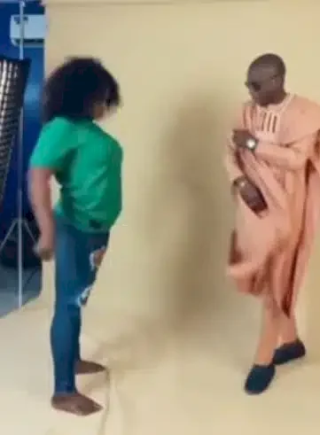 Confusion as camerawoman suddenly goes into trance during photoshoot (Video)