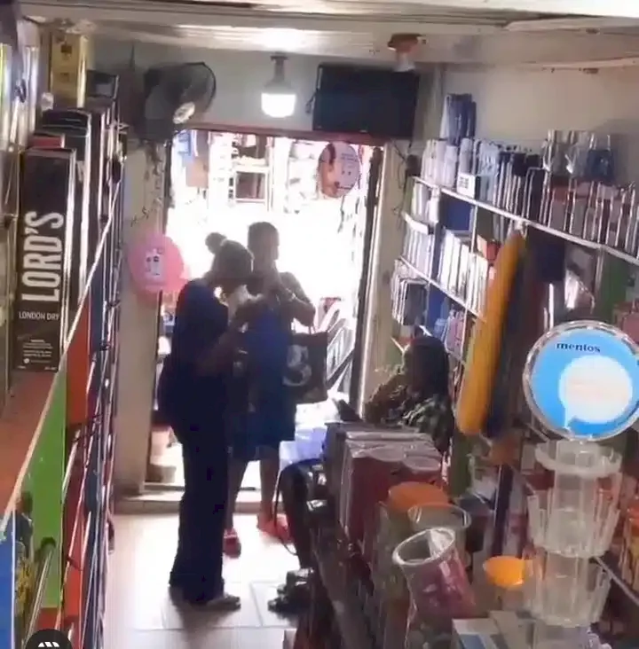 Moment vendor falls unconscious and robbed after she was sprayed unknown substance (Video)