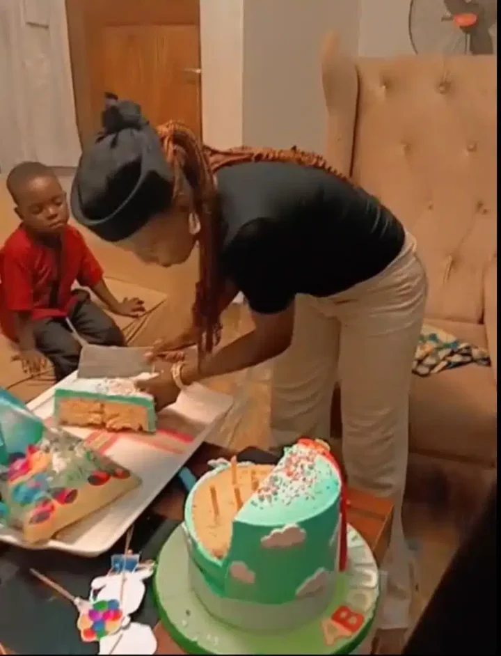 'Na Dangote cement dem use bake am?' - Speculations as mother struggles to cut birthday cake