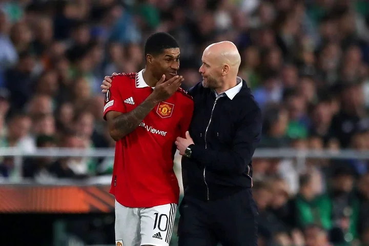 Erik ten Hag, Manager of Manchester United, speaks with his player Marcus Rashford during the UEFA Europa League round of 16 leg two match between ...