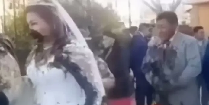 Groom's ex- girlfriend throws poop at him and new bride after storming their wedding (video)