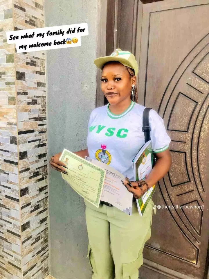 'First graduate' - Family sets up huge banner as their daughter completes NYSC