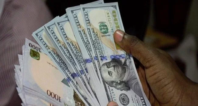 Naira appreciates against dollar in official window, falls in black market
